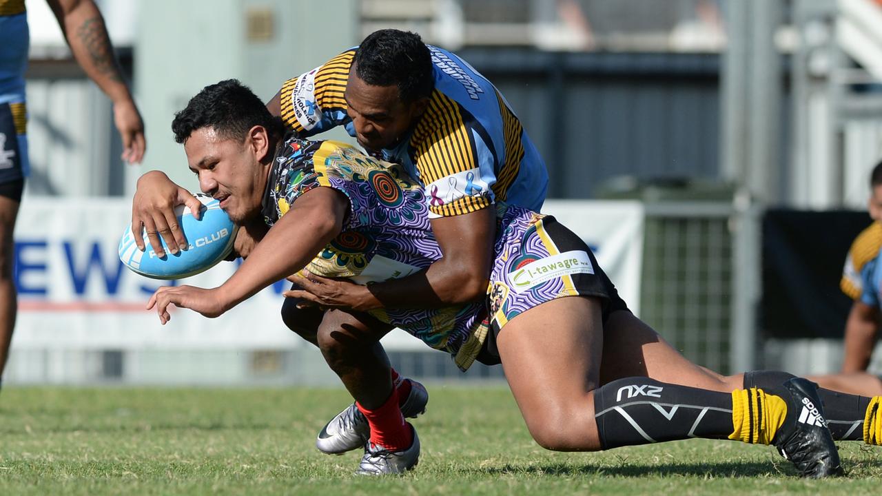 Johnny Filipino gounds the ball for one of his three tries while playing for Black Magic in the men’s grand final of the Warba Wangarunya indigenous Rugby League Carnival in Rockhampton.