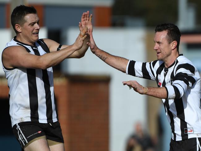 Scoresby veterans Marc Williams and Matt Krawczyk celebrate a goal. Picture: James Ross/AAP