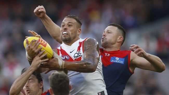 MELBOURNE, AUSTRALIA - APRIL 02: Michael Hibberd of the Demons marks the ball against Lance Franklin of the Swans during the round three AFL match between Melbourne Demons and Sydney Swans at Melbourne Cricket Ground, on April 02, 2023, in Melbourne, Australia. (Photo by Daniel Pockett/Getty Images)
