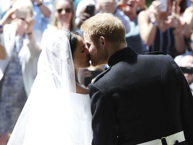 For the cameras! The kiss everyone wanted to see. Picture: AP