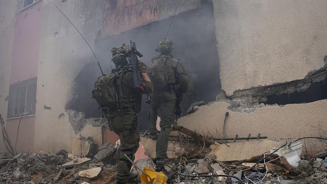 Israeli troops enter a building in Khan Younis at the weekend. Picture: AFP