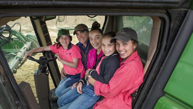 Two of Tim Jensz's daughters are helping out with their first harvest this year. Pictured are Tim Jensz with his daughters (left to right) Anabel, 10, Matilda, 14, Phoebe, 8, and Charlotte, 16. Picture: Zoe Phillips