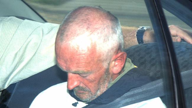 Clive Nicholson arriving at Southport watchhouse with detectives after handing himself in. Picture: David Clark