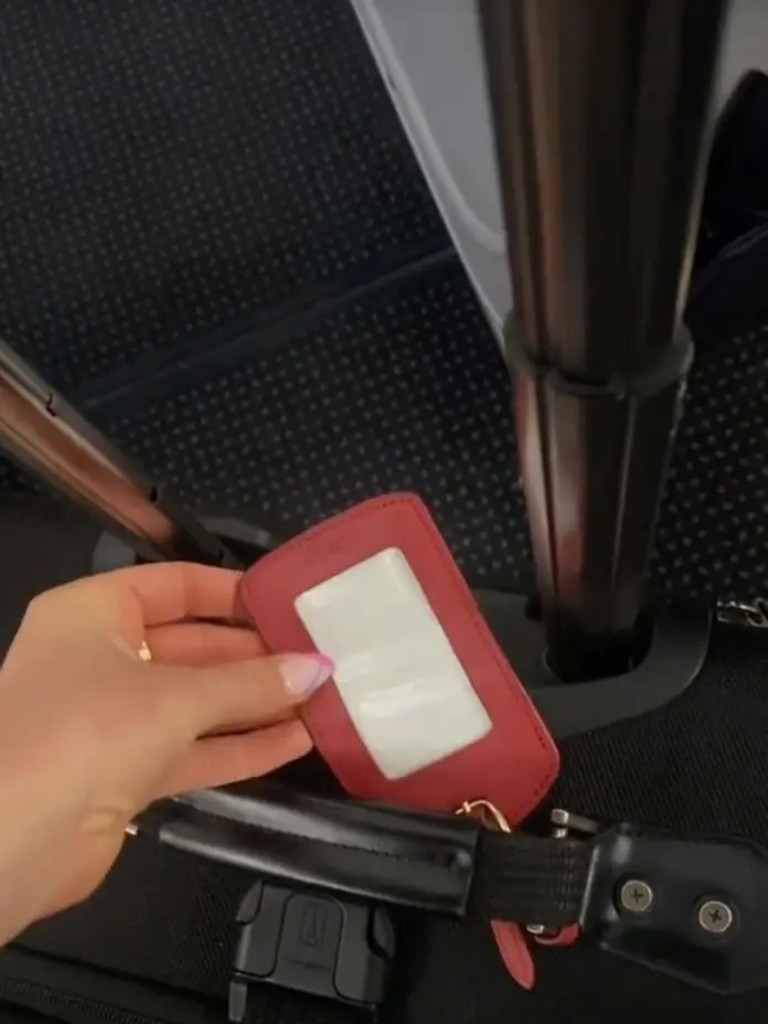 She recommends flipping the paper inside the luggage tag to the opposite side to hide personal information. Picture: TikTok/allycase1