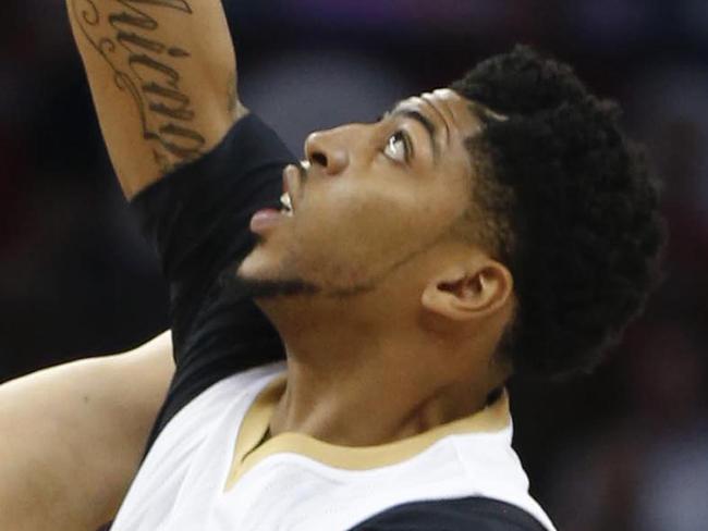 New Orleans Pelicans forward Anthony Davis (23) leaps for the opening tipoff against Cleveland Cavaliers center Timofey Mozgov (20) in the first half of an NBA basketball game in New Orleans, Friday, Dec. 4, 2015. (AP Photo/Gerald Herbert)