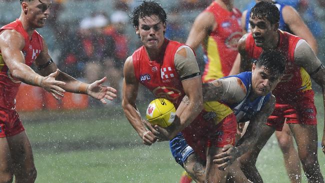 Jack Bowes of the Suns passes during the Round 1 AFL match between the Gold Coast Suns and the North Melbourne Kangaroos at Cazaly's Stadium in Cairns, Saturday, March 24, 2018. (AAP Image/Brian Cassey)