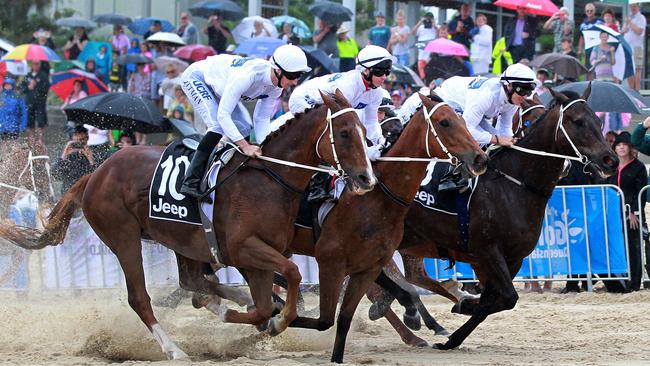 Nothing says the Gold Coast more than a horse race on the beach. Picture Mike Batterham