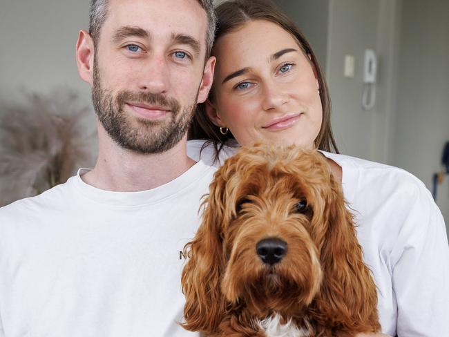 Rory Esler who received a shock diagnosis of  Advanced Stage 3 metastatic bowel cancer, at home in New Farm with partner Olivia and dog George. Picture Lachie Millard