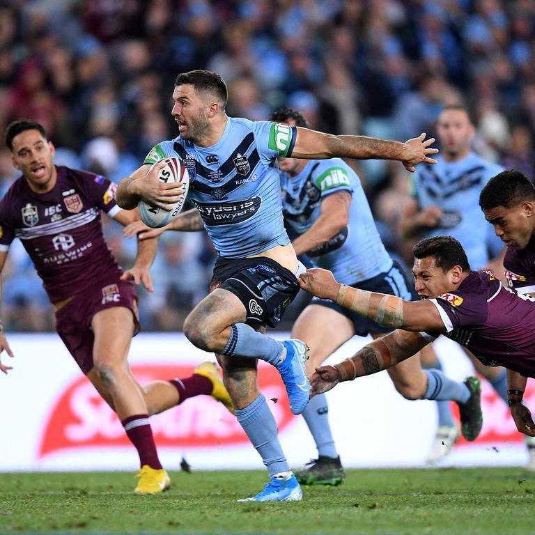 James Tedesco busts through an attempted tackle by Josh Papalii to seal the 2019 State of Origin series. Picture: AAP Image/Dan Himbrechts