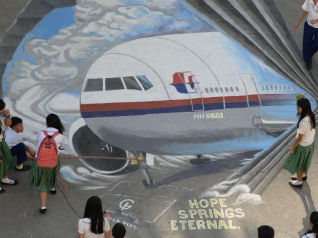 MH370 families want focus on debris