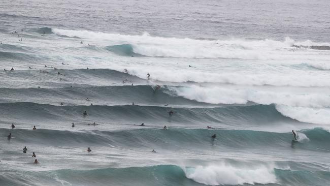 Surfers at Snapper Rocks and Kirra riding the Large swell produced by Cyclone OMA. Photograph : Jason O'Brien