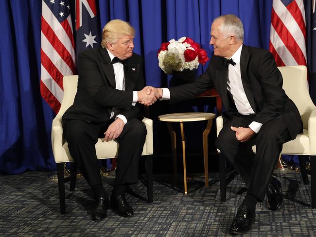 President Donald Trump shakes hands with Prime Minister Malcolm Turnbull aboard the USS Intrepid. Picture: AP Photo/Pablo Martinez Monsivais