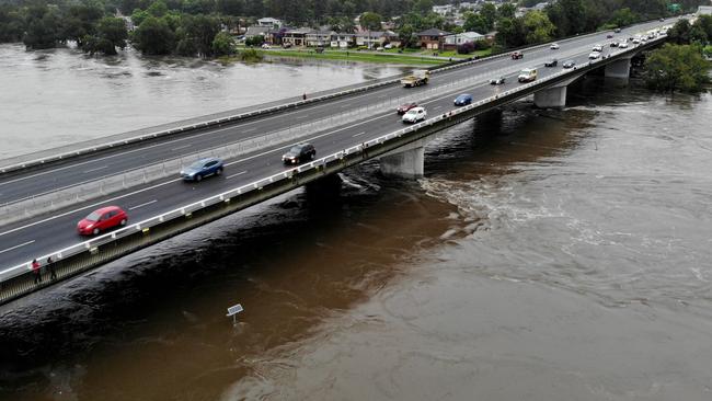 Sydney continues to be drenched in heavy rains causing flooding in local areas and the Warragamba Dam to overflow, sending millions of litres of water down the Nepean River to low lying areas like Emu Plains. Flood waters rising to just below the Nepean Bridge. Picture: Toby Zerna