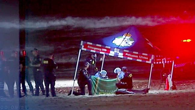 Police at the scene where a baby’s body was found on a Gold Coast beach - Photo Supplied CH 7