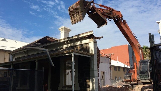 One of two bluestone cottages on Hutt St are torn down an apartment tower which has since been shelved. Picture: Sandy Wilkinson