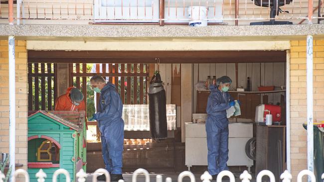 Police crime scene investigators at the Wishart Road house. PICTURE: Brad Fleet