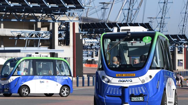 Two of the new driverless buses being trialled at Sydney Olympic Park in Sydney, Monday, October 28, 2019. (AAP Image/Dean Lewins)/