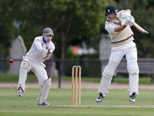 Oakleigh’s Elliott Fabris punches off the back foot against St Bernard’s.