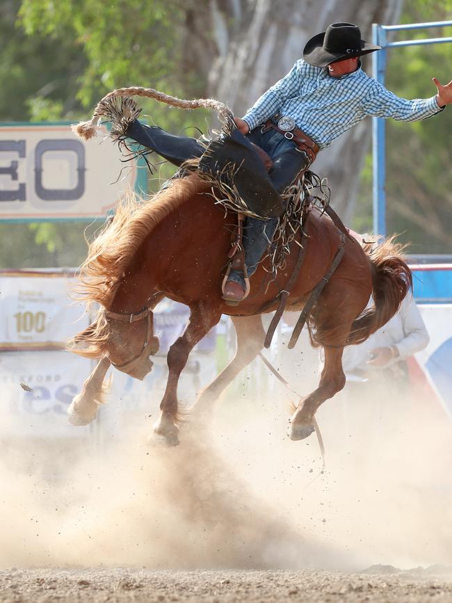 Competitors had to hold on tight in the open saddle bronc.