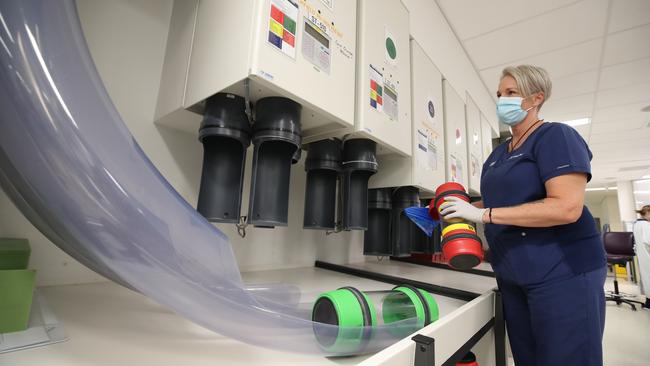 Senior CSR co-ordinator Tanya Boyd at pneumatic tubes where samples arrive from the hospital. Picture: Glenn Hampson.