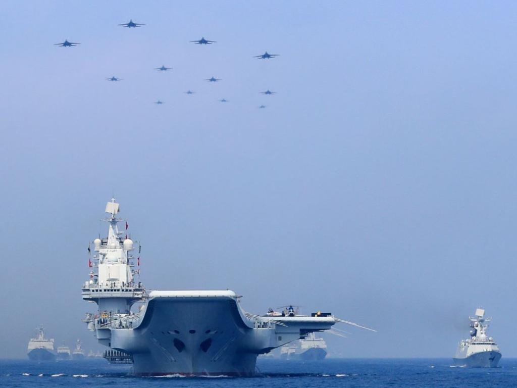 Chinese warships and fighter jets take part in a military display in the South China Sea in April. Picture: Xinhua