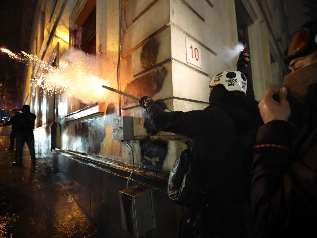 Demonstrators throw fireworks at police. Picture: Giorgi ARJEVANIDZE / AFP