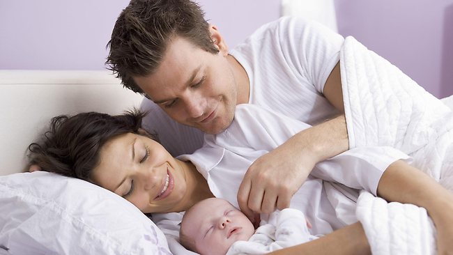 Parents with sleeping baby