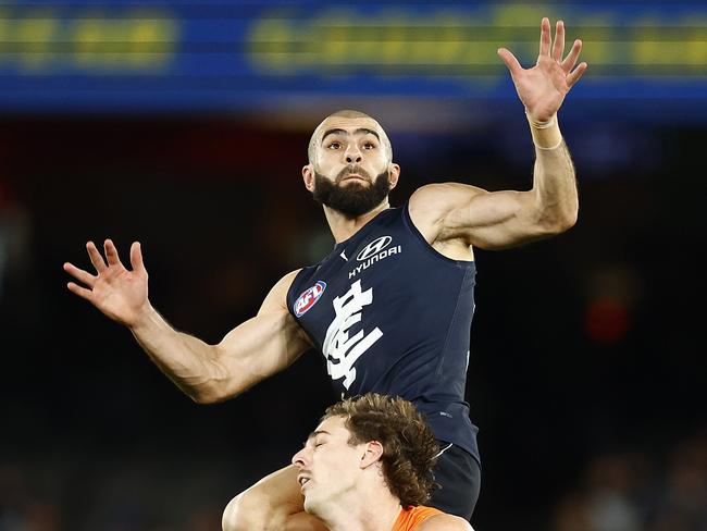 MELBOURNE, AUSTRALIA - JULY 24: Adam Saad of the Blues takes a high mark over James Peatling of the Giants during the round 19 AFL match between the Carlton Blues and the Greater Western Sydney Giants at Marvel Stadium on July 24, 2022 in Melbourne, Australia. (Photo by Daniel Pockett/Getty Images)