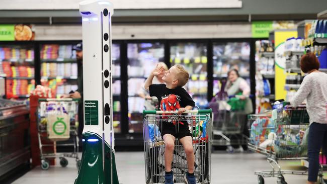 James Graham meets Ez, the high tech robot keeping customers safe at Woolworths in Erina. Picture: Sue Graham