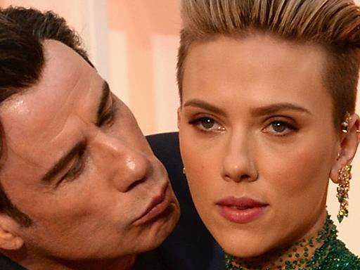 HOLLYWOOD, CA - FEBRUARY 22: Actor John Travolta (L) and actress Scarlett Johansson attend the 87th Annual Academy Awards at Hollywood & Highland Center on February 22, 2015 in Hollywood, California. (Photo by Kevin Mazur/WireImage)