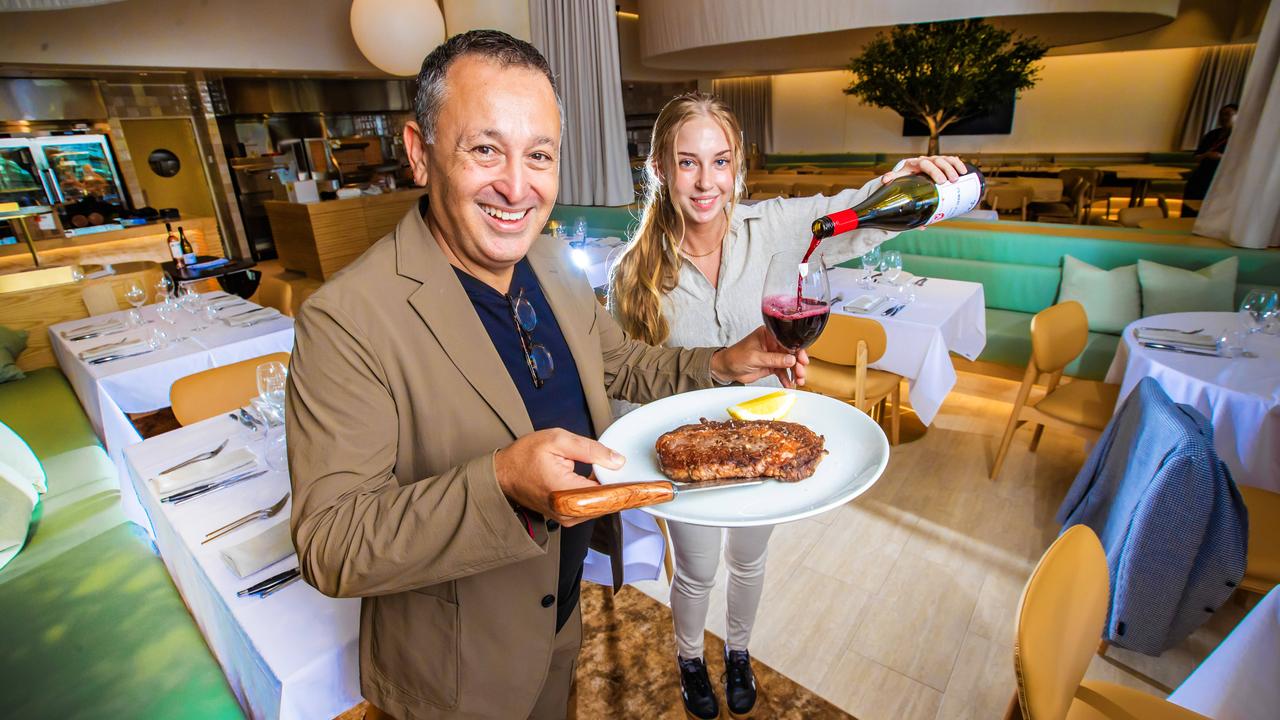 John Gambaro with staff member Ella Feeney at his new restaurant Black Hide Steak and Seafood in Queens Wharf. Picture: Nigel Hallett