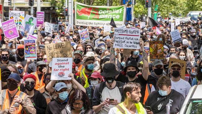 Anti-fascist protesters mach through Carlton. Picture: Jason Edwards