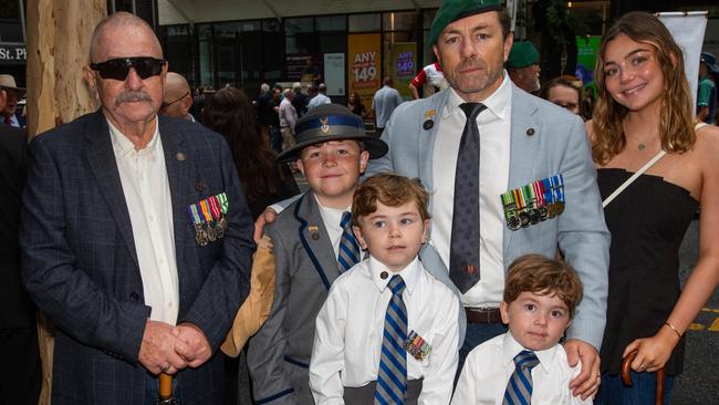 Thousands of people have braved the rain to gather in Brisbane for Anzac Day services. Picture: Grace Kessels
