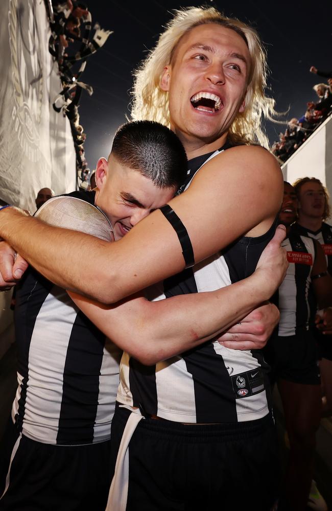 Collingwood skipper Darcy Moore hugs Brayden Maynard after the preliminary final win. Picture: Michael Klein.