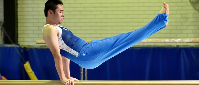 Raymond Xing on the high bar at YMCA Epping. Picture: AAP Image / Troy Snook