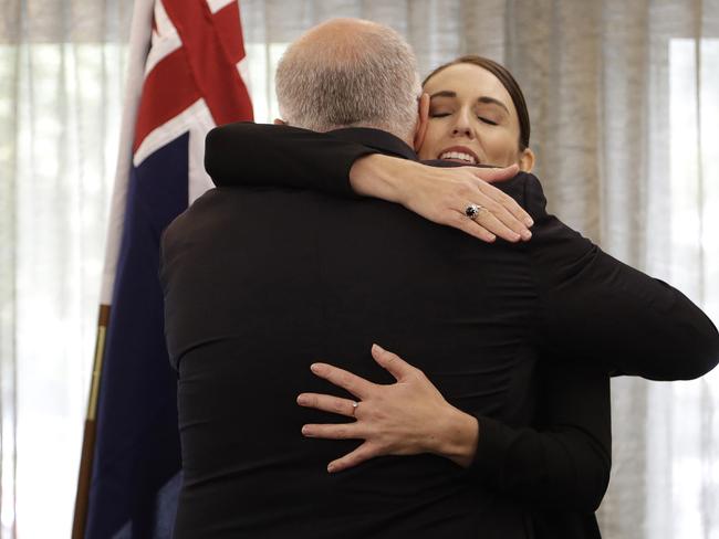 Jacinda Ardern, right, is embraced by Scott Morrison following a national remembrance service for the victims of the March 15 mosques terrorist attack on March 29 in Christchurch. Picture: Getty