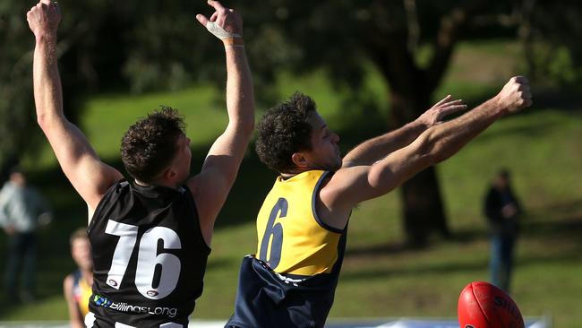 NFL: Montmorency’s Josh Mills and Liam Middleton of Hurstbridge fight for the ball. Picture: Hamish Blair