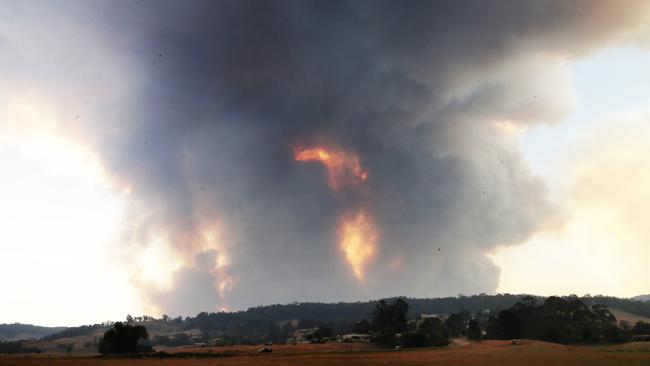 Smoke rises from an out-of-control fire on a ridge near Bruthen. Picture: David Crosling