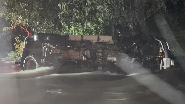 A car was submerged in water after navigating a flooded road in Berry Springs. Picture: Facebook / Rehanna Mortimer