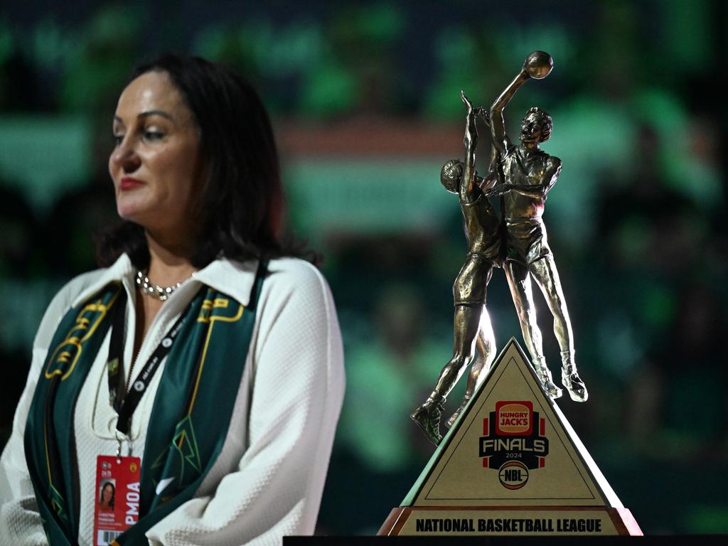 Tasmania chief executive Christine Finnegan with the NBL title trophy at the JackJumpers championship banner unveiling. Picture: Getty Images