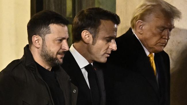 France's President Emmanuel Macron (C) walks with US president-elect Donald Trump (R) and Ukraine's President Volodymyr Zelensky (L) after a meeting at the Elysee Presidential Palace in Paris. Picture JULIEN DE ROSA / AFP