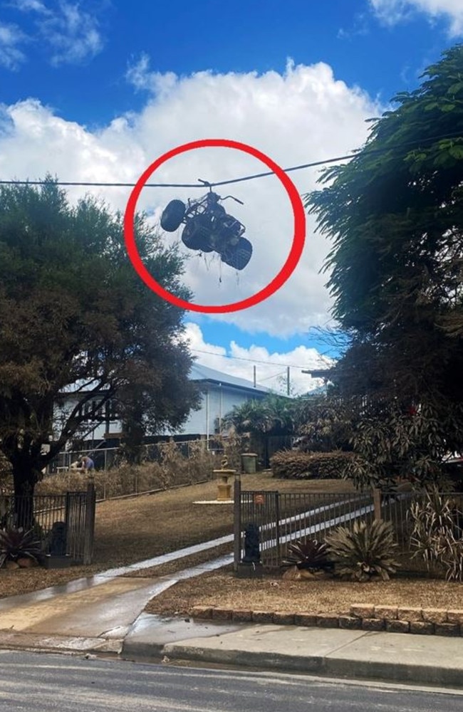 Floodwaters at Gympie rose so high a quad bike was washed onto power lines. Picture: Facebook