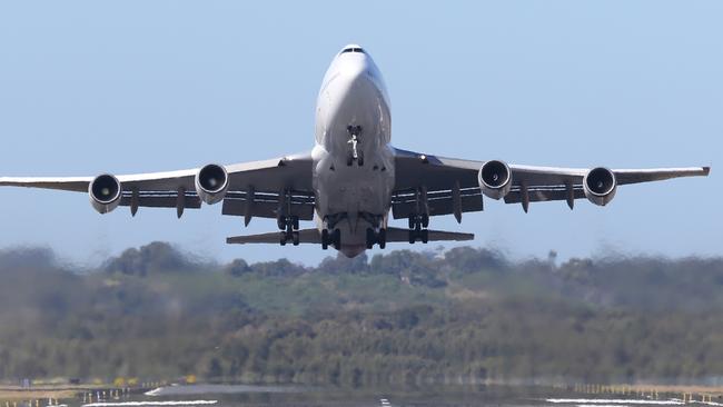 A Qantas jumbo takes off from Gold Coast Airport after fog closed Brisbane Airport in June last year. Picture Glenn Hampson