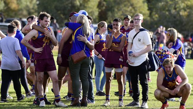 O'Sullivan's Beach/Lonsdale players contemplate their division seven grand final defeat in 2018. The Lions have been relegated after one season in the sixth tier. Picture: AAP/Bianca De Marchi