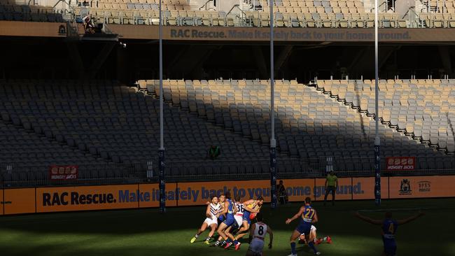 The Eagles and Dockers battle in an empty stadium.