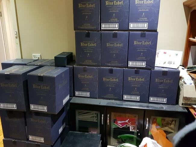 Cases of Johnny Walker blue label were found in the raid.