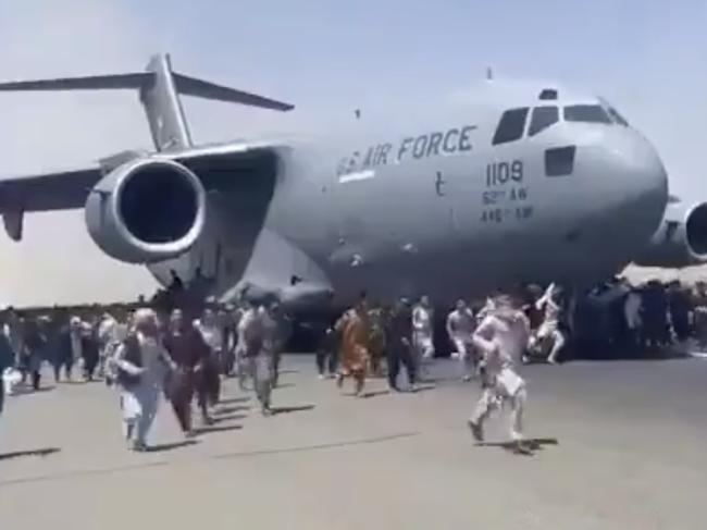 TOLOnews, @TOLOnews, Video: People run on tarmac of Kabul international airport as a US military aircraft attempts to take off.