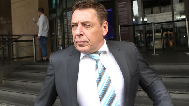 Mark Thompson leaves Melbourne Magistrate Court.