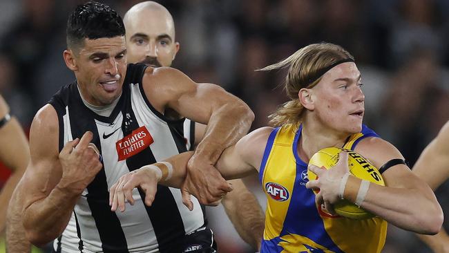 Scott Pendlebury in his 392nd AFL game grapples with No. 1 draft pick Harley Reid in Collingwood’s big win over West Coast on Sunday. Picture: Michael Klein