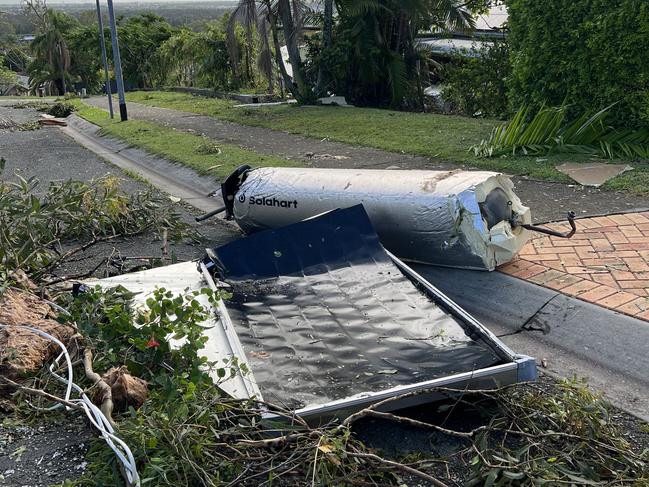 A hot water system lying on a Helensvale street early on Boxing Day. Picture: Keith Woods.